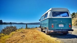blue campervan in sunshine