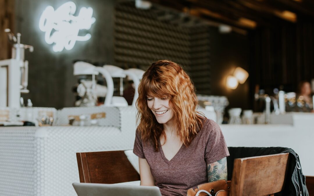 A woman sat at a desk doing an online teaching job