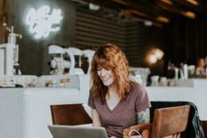 A woman sat at a desk doing an online teaching job